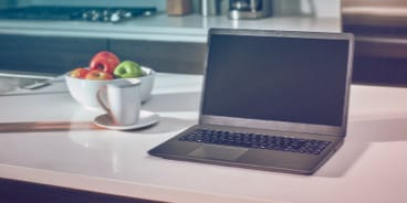 A laptop computer on a table.