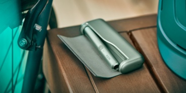 A Jade Green IQOS ILUMA PRIME device in an open case.